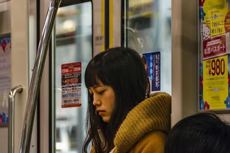 TOKYO, JAPAN, JANUARY - 2019 - Attractive young asian woman standing at train, tokyo, japanのeditorial素材