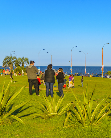 MONTEVIDEO, URUGUAY, OCTOBER - 2019 - People enjoying a nice spring day at waterfront park in buceo neighborhood, montevideo, uruguayのeditorial素材