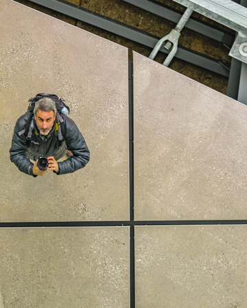 TOKYO, JAPAN, JANUARY - 2019 - Adult caucasian man taking an unusual angle perspective selfie