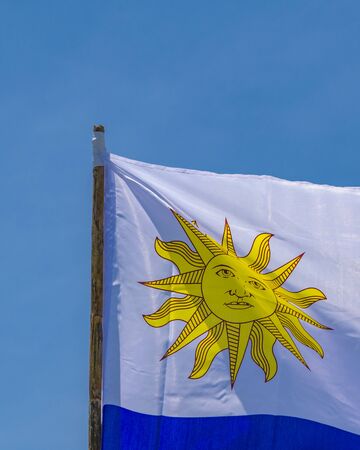 Close up detail view uruguayan flag waving over blue sky backgroundの写真素材