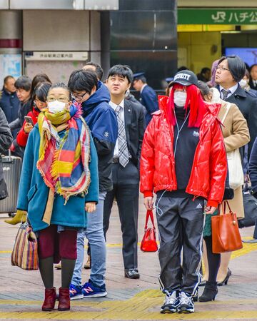 TOKYO, JAPAN, JANUARY - 2019 - People waiting to cross at famous crosswalk at shibuya district, tokyo, japanのeditorial素材