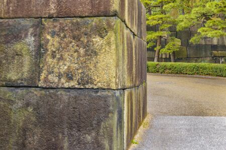 Ancient stone patterned wall of imperial palace gardens, tokyo, japan