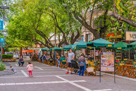 MENDOZA, ARGENTINA, APRIL - 2019 - Autumn day scene at sarmiento pedestrian sidewalk at mendoza capital, argentinaのeditorial素材