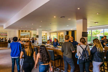 MENDOZA, ARGENTINA, APRIL - 2019 - People tasting wine at wine cellar, mendoza province, argentina