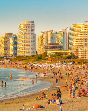 PUNTA DEL ESTE, URUGUAY, FEBRUARY - 2020 -  Summer scene at crowded mansa beach in punta del este city, Uruguayのeditorial素材