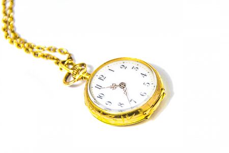 Antique golden watch isolated on black backgroundの写真素材