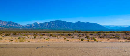Dust created by car at grave highway, san juan province, argentinaの写真素材