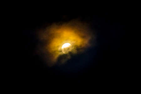 Moon cover by clouds night scene, calingasta district, san juan province, argentina