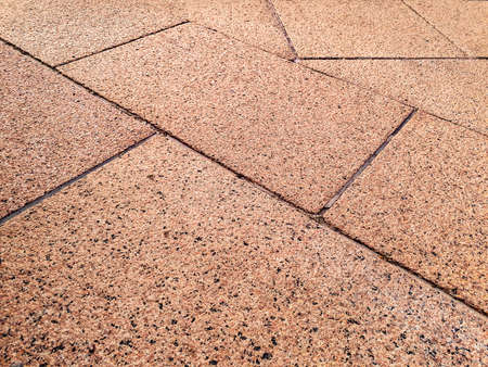 High angle shot granite sidewalk detail texture backgroundの写真素材