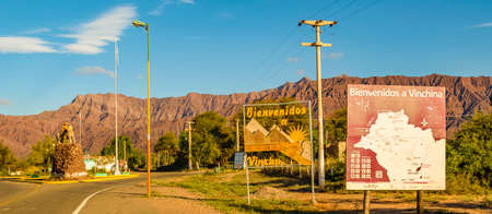 LA RIOJA, ARGENTINA, APRIL - 2019 - Empty highway with signpost with spanish text "welcome to vinchina"のeditorial素材