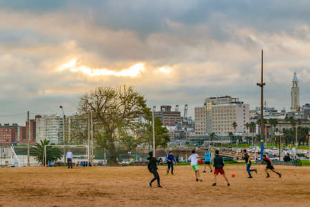 MONTEVIDEO, URUGUAY, AUGUST - 2020 - Teens playing soccer at ground field at ciudad vieja neighborhood, montevideo, uruguayのeditorial素材