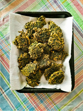 Top view home made vegetable fritters over tableclothの写真素材