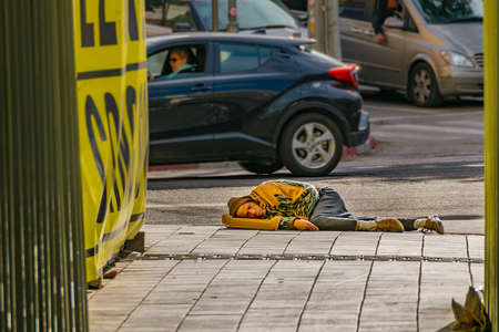 TEL AVIV, ISRAEL, DECEMBER - 2019 - Urban scene homeless sleeping at sidewalk, tel aviv, israelのeditorial素材