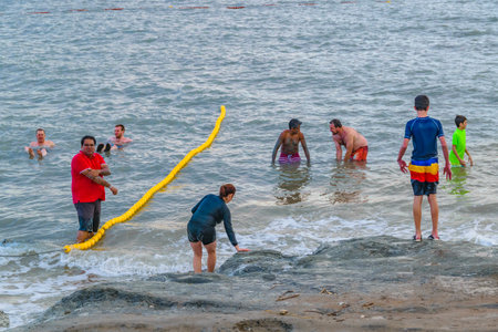 JERUSALEM, ISRAEL, DECEMBER - 2019 - People enjoying famous dead sea kalia beach, israelのeditorial素材