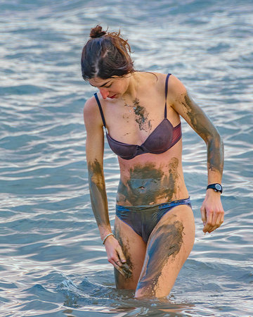 JERUSALEM, ISRAEL, DECEMBER - 2019 - Attractive young woman at famous dead sea kalia beach, israelのeditorial素材