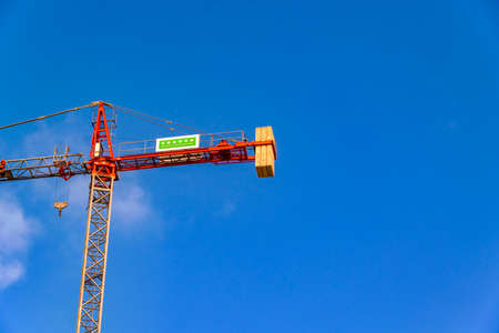 Low angle shot tall crane at building constructionのeditorial素材