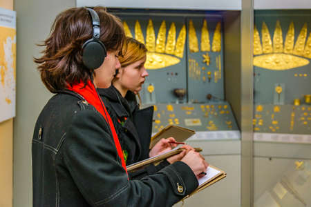 ATHENS, GREECE, JANUARY - 2020 - Art student sketching sculpture at archaeological musuem of athens