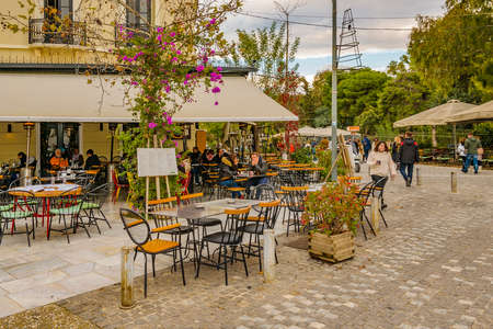 ATHENS, GREECE, DECEMBER - 2019 - Winter urban scene at restaurants zone in peripatus street, plaka district, athens, greeceのeditorial素材