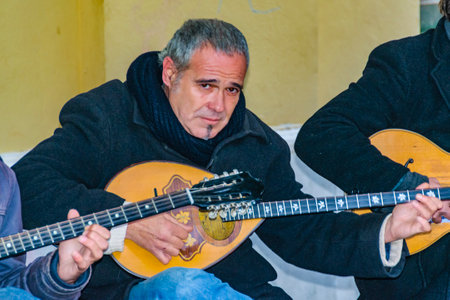 ATHENS, GREECE, DECEMBER - 2019 - Street musicians playing traditional greek music, plaka district, athens, greeceのeditorial素材