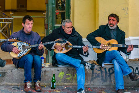 ATHENS, GREECE, DECEMBER - 2019 - Street musicians playing traditional greek music, plaka district, athens, greeceのeditorial素材