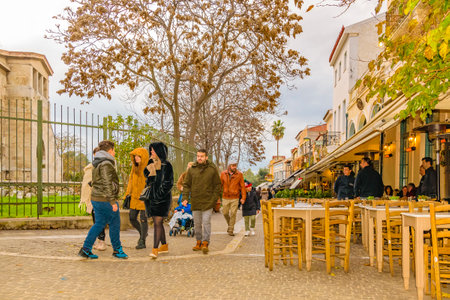 ATHENS, GREECE, JANUARY - 2020 - Urban winter day scene at typical touristic restaurants zone in plaka district.の写真素材