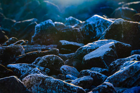 Cold scene big rocks illuminated by sunlightの写真素材