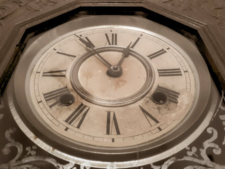 Low angle detail shot antique winding wall clock