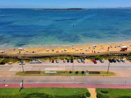 PUNTA DEL ESTE, URUGUAY, JANUARY - 2021 - Crowded mansa beach aerial shot from waterfront apartment view, punta del este, uruguayのeditorial素材