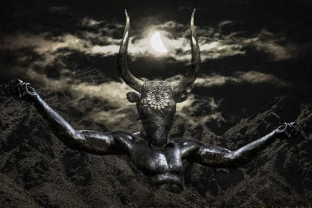 Dark creepy mythological scene minotaur rising at mountains over night cloudy sky backgroundの写真素材
