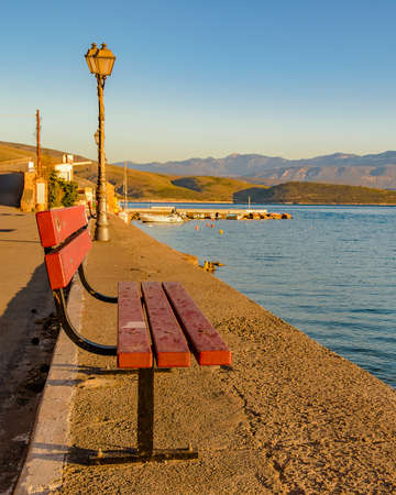 Tranquil morning winter scene at boardwalk of galaxidi city, greeceの写真素材