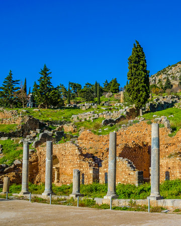 Sunny day scene at entrance of delphi sanctuary, phocis, greeceのeditorial素材