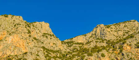 Big rocky mountains at delphi sanctuary, phocis, greeceの写真素材