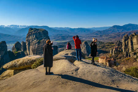 METEORA, GREECE, JANUARY - 2020 - Tourist at top of rocky landscape, meteora site, thessaly, greece.のeditorial素材