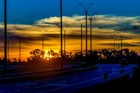 Empty highway landscape at sunset time, maldonado, uruguayの写真素材