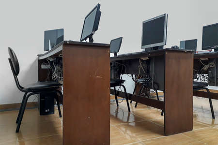 Interior scene of neglected empty computer classroom