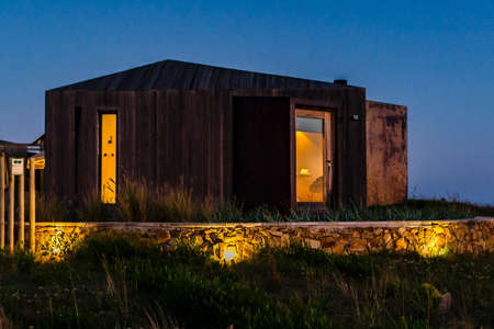 Night outdoor scene wooden boutique house, maldonado, uruguay