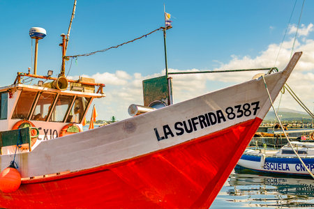 PIRIAPOLIS, URUGUAY, MARCH - 2022 - Rustic fishing boat parked at piriapolis city port, maldonado,...