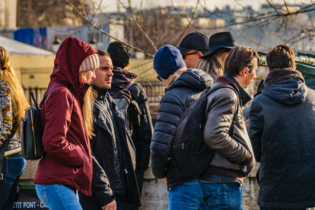 PARIS, FRANCE, JANUARY - 2020 - Long shot urban scene crowd walking at street of paris, france