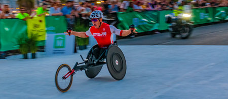 MONTEVIDEO, URUGUAY, NOVEMBER - 2022 - Wheelchair athlete winning san felipe y santiago race, the most traditional running race of montevideo city, uruguayのeditorial素材