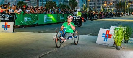 MONTEVIDEO, URUGUAY, NOVEMBER - 2022 - Wheelchair athlete arriving goal at san felipe y santiago race, the most traditional running race of montevideo city, uruguayのeditorial素材