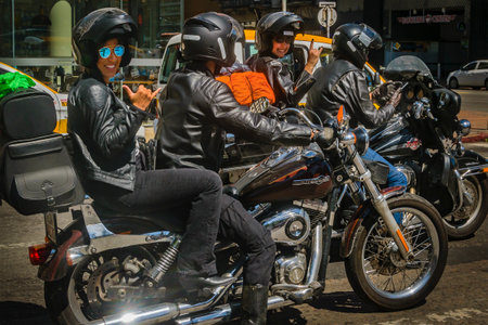 MONTEVIDEO, URUGUAY, NOVEMBER - 2022 - Two couples of bikers at red light in the street of montevideo city, uruguayのeditorial素材