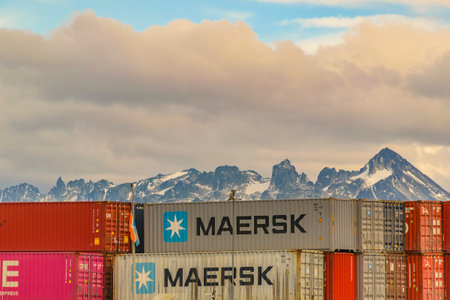 USHUAIA, ARGENTINA, APRIL - 2022 - Big containers and snowy mountains at background in ushuaia port, tierra del fuego, argentinaのeditorial素材