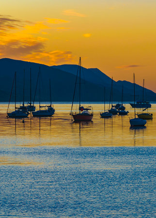 Boats and yachts parked near cost at beagle channel, ushuaia city, tierra del fuego, argentinaの写真素材