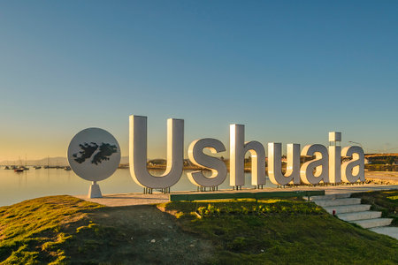 Ushuaia letters at border of bay sunny empty day landscape sceneの写真素材