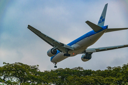 Samborondon, Ecuador; August 22 2022: Low angle shot commercial plane flying at cloudy sky,...