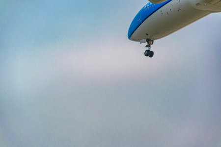Low angle shot commercial plane flying at cloudy sky, Samborondon, Ecuadorの写真素材