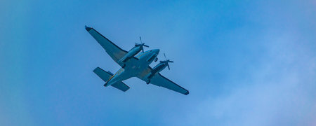 Low angle shot propeller plane flying at cloudy sky, samborondon, ecuadorのeditorial素材