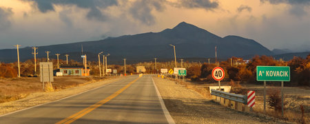Highway crossing Patagonian forest landscape environment, Tierra del Fuego province, Argentinaの写真素材