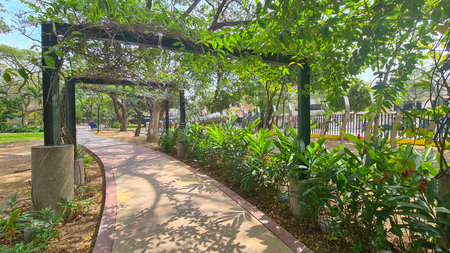 Sunny day at empty urban Keneddy linear park, Guayaquil, Ecuador