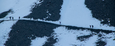 Long distant shot people walking trough path at martial glacier, ushuaia, Tierra del Fuego,...